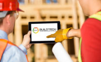 Contractors pointing to iPad with AEC BuildTech logo on the screen 